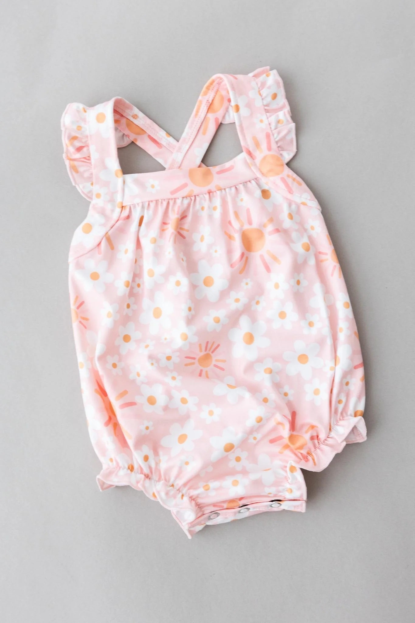 ruffle cross back romper- sweet and sunny